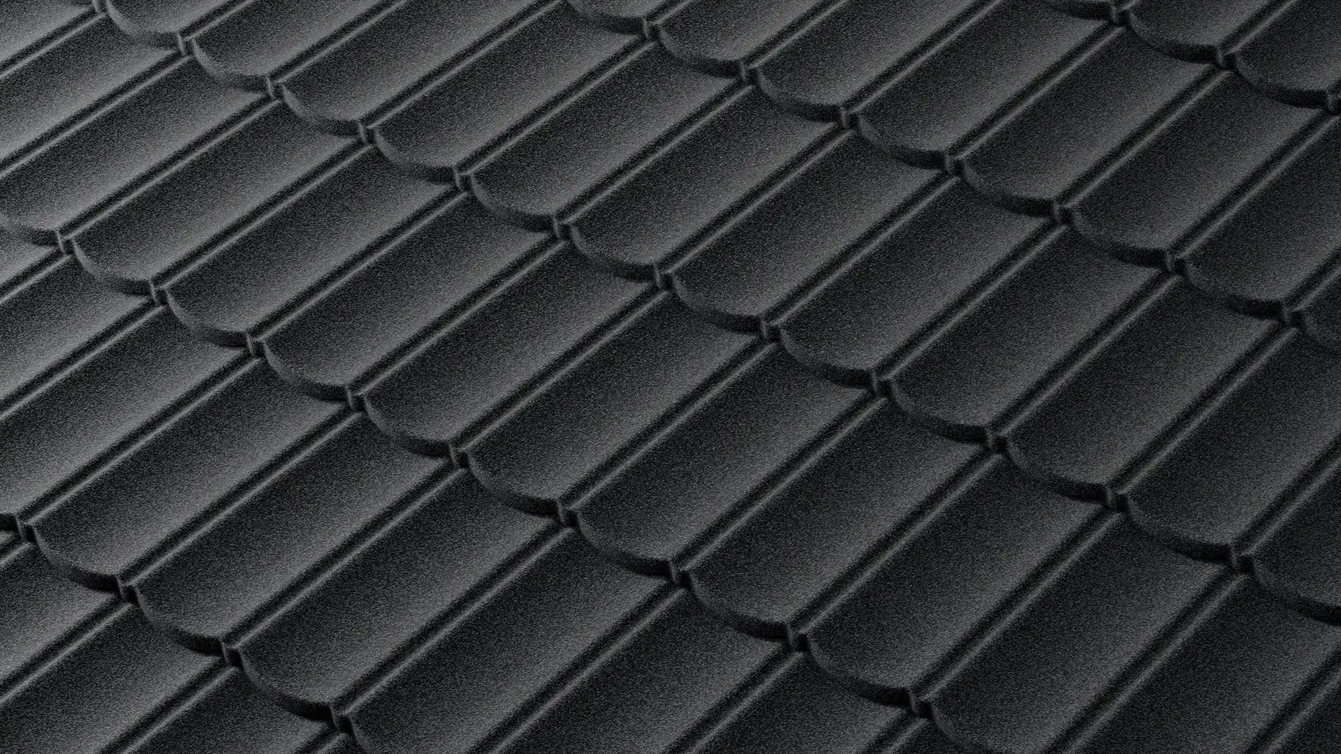Close-up of Tilcor Bond low-profile stone-coated steel tile in charcoal grey